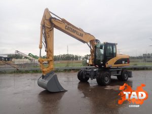 1964572123 kolesnyj ekskavator caterpillar