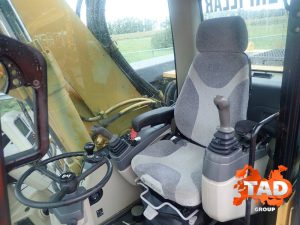 1964578952 kolesnyj ekskavator caterpillar